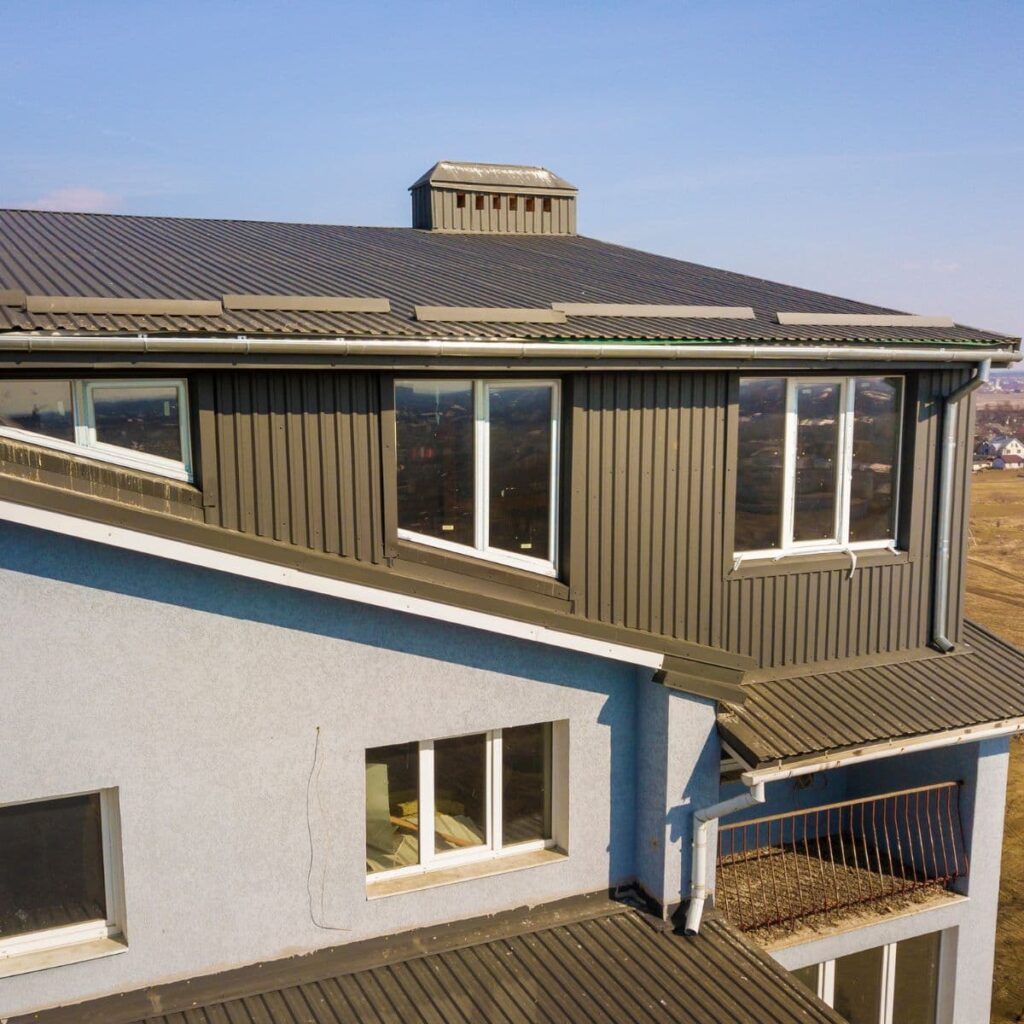 metal siding on a commercial building with a fresh coat of ceramic painting