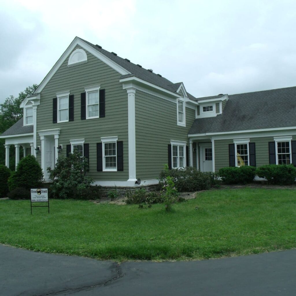 siding with fresh green paint